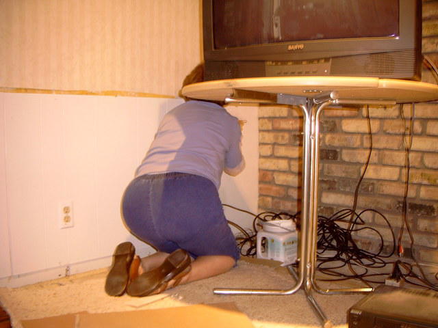 Mom painting the wall.